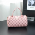 Pink boston bag with circle print and butterfly charm featuring a gold chain strap - Small / Pink
