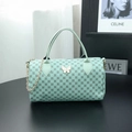 Minzgrüne Boston Bag mit Kreismuster, Schmetterlingsverschluss und Metallkette - Grün