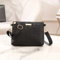 Quilted black envelope crossbody bag with gold hardware and wide shoulder strap - Black