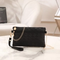 Chic black quilted clutch bag with dual gold zippers and elegant chain strap - Black