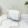 White quilted shoulder bag with gold chain and unique geometric flap design - White