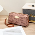 Pinkish brown leather clutch with repeated SAKM logo pattern and gold metal hardware - Khaki Brown