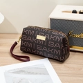 Vintage dark brown handbag with purple floral patterns and a red wrist strap - Wine Red Coffee