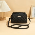 Chic black quilted crossbody camera bag with gold hardware and adjustable strap - Black