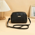 Elegant black crossbody bag with zigzag quilting and gold-tone metal hardware - Black Wave