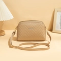 Beige quilted crossbody camera bag with V-shaped stitching and golden hardware detail - Khaki Wave Pattern