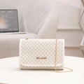 White flap shoulder bag with yellow floral print and elegant gold chain strap - White