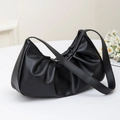 Minimalist black cloud shoulder bag with pleated faux leather texture on white background - Black