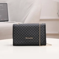 Classic black flap crossbody bag with floral monogram pattern and gold chain strap - Black