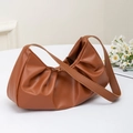 Brown ruched shoulder bag in pleated crescent cloud shape with synthetic leather finish - Earthy Yellow