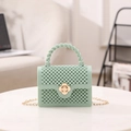 Borsa a mano verde menta traforata con trama a perline e chiusura a fiore dorata - Verde