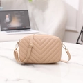Beige quilted crossbody bag with V-shaped stitching and adjustable strap in a chic design - Khaki