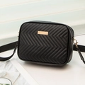 Chic black chevron quilted crossbody bag with golden hardware and wide fabric strap - Black