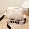 Cream embroidered crossbody bag with wide letter strap and quilted faux leather finish - White