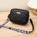 Quilted black crossbody camera bag with gold hardware and woven logo guitar strap - Black
