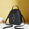 Women's black mini clover print backpack with a cute gold-trimmed cat charm and PU leather - Black