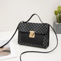 Chic black and grey crossbody bag with geometric patterns and golden rotary buckle - Black