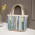 Colorful woven tote bag with white leather straps and golden metal hardware details - Style 2