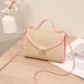Beige woven straw crossbody bag with pink leather trim and gold buckle lock - Pink