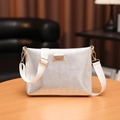 Silver textured crossbody bag with gold hardware and wide adjustable white strap - Silver Striped Buckle