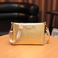 Bright gold crossbody envelope bag with quilted wave texture and adjustable strap - Rhombic Gold