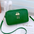 Quilted green camera bag with gold swan hardware and an elegant chevron texture - Green