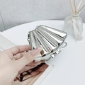 Mini silver shell-shaped acrylic clutch bag with shiny metallic finish and chain strap - White Shell Silver