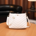 White quilted bucket bag for women with V-shaped stitching and wide textile strap - White