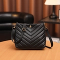 Classic black V-quilted crossbody bucket bag with adjustable strap and gold hardware - Black