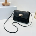 Classic black quilted crossbody bag with gold rotating clasp and slender strap - Black