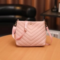 Pink quilted bucket bag for women with elegant gold hardware and wide fabric shoulder strap - Pink