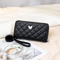 Black quilted butterfly wallet in plush faux leather with pompom and wrist strap - Black