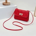 Red quilted crossbody bag with stylish gold rectangle lock and slim shoulder strap - Red