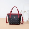Retro printed bucket bag in dark grey with red leather handles and gold floral hardware - Red