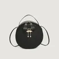 Classic black round shoulder bag with woven texture and golden flamingo metal charms - Black