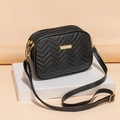 Compact black quilted crossbody bag with golden hardware and V-shaped embroidery details - Black E