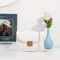 Elegant white quilted crossbody bag with gold chain strap and metallic twist lock - White