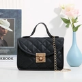 Chic black quilted crossbody bag with gold chain strap and metallic press lock closure - Black