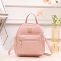 Fashionable pink PU leather mini backpack with front zip pocket and golden metal plate - Pink