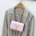 Pink embossed crossbody bag with golden deer head logo and elegant chain strap - Pink