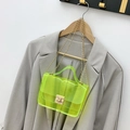 Neon yellow transparent PVC chain bag hanging on a hanger for a stylish modern look - Green