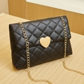 Black quilted crossbody bag with golden heart-shaped lock and chain strap for women - Black