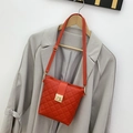 Quilted diamond lattice small crossbody bag in orange with gold metal twist lock - Red