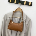 Brown quilted shoulder bag with rhombic pattern and gold zipper detail on a hanger - Brown