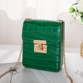 Elegant green crocodile pattern mini crossbody bag with gold chain strap on display - Green