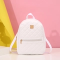 White quilted mini backpack for women with golden zippers and a stylish geometric background - White