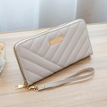Women's light grey chevron quilted long wallet with golden zipper and wrist strap - Gray