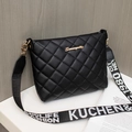 Quilted black bucket bag with gold hardware and wide letter-printed shoulder strap - Black
