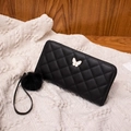 Black quilted long wallet for women with golden butterfly logo and plush pom pom - Black