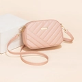 Pink quilted crossbody bag with chevron stitching and adjustable shoulder strap - Pink